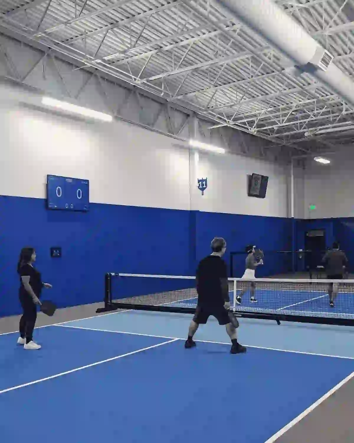 Partie de pickleball en double pour comprendre comment jouer